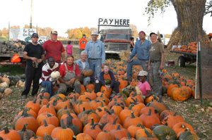pumpkins and workers at pay station